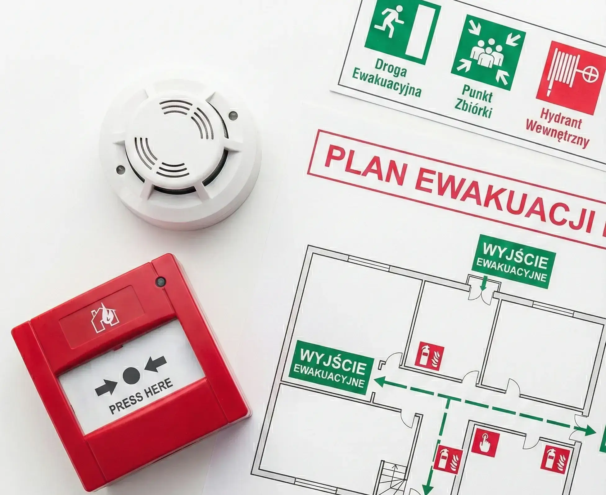 Elementy organizacji ewakuacji: wydrukowany plan ewakuacji, zestaw znaków bezpieczeństwa (wyjście ewakuacyjne, punkt zbiórki, hydrant) oraz urządzenia alarmowe